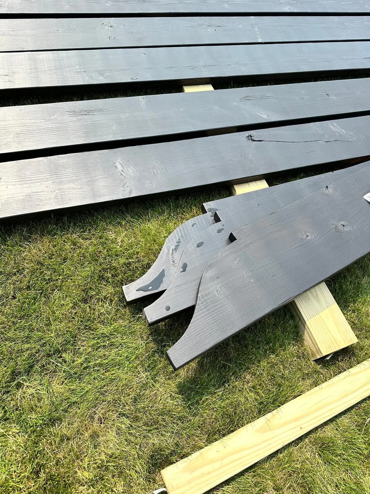 Black aluminum railing components staged for install — Buffalo NY