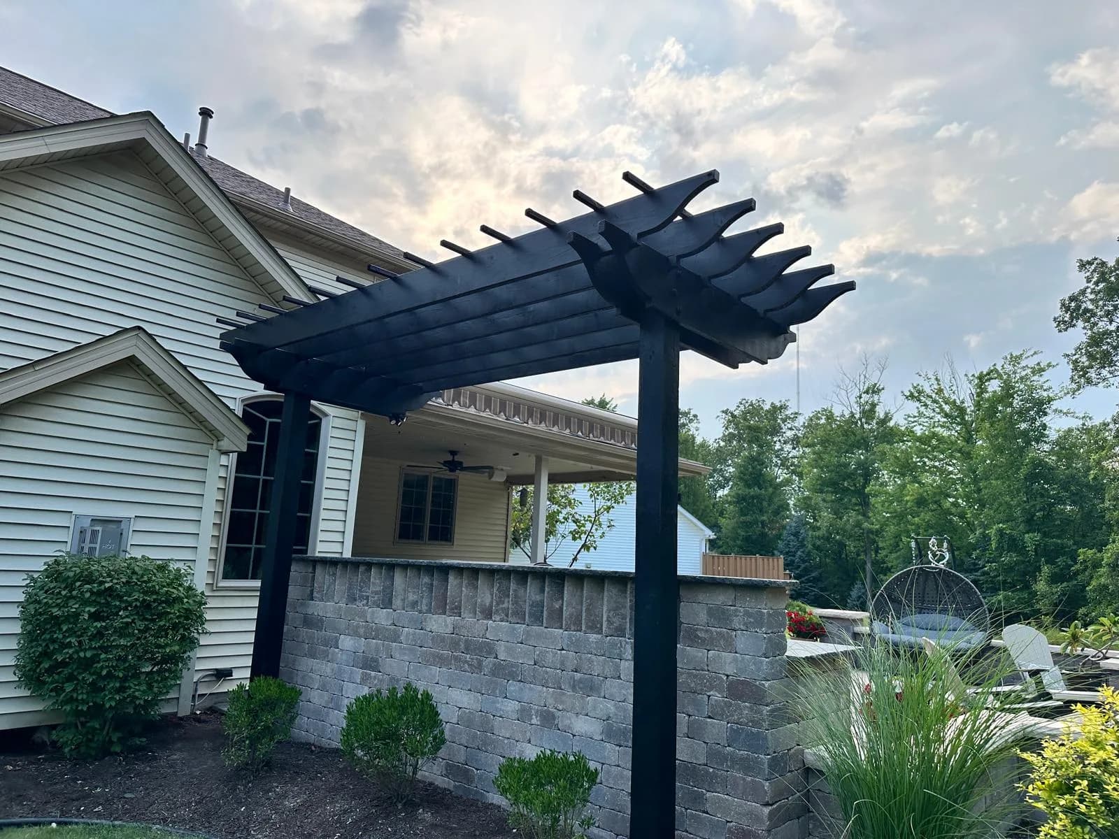 Black pergola patio side view — Buffalo NY