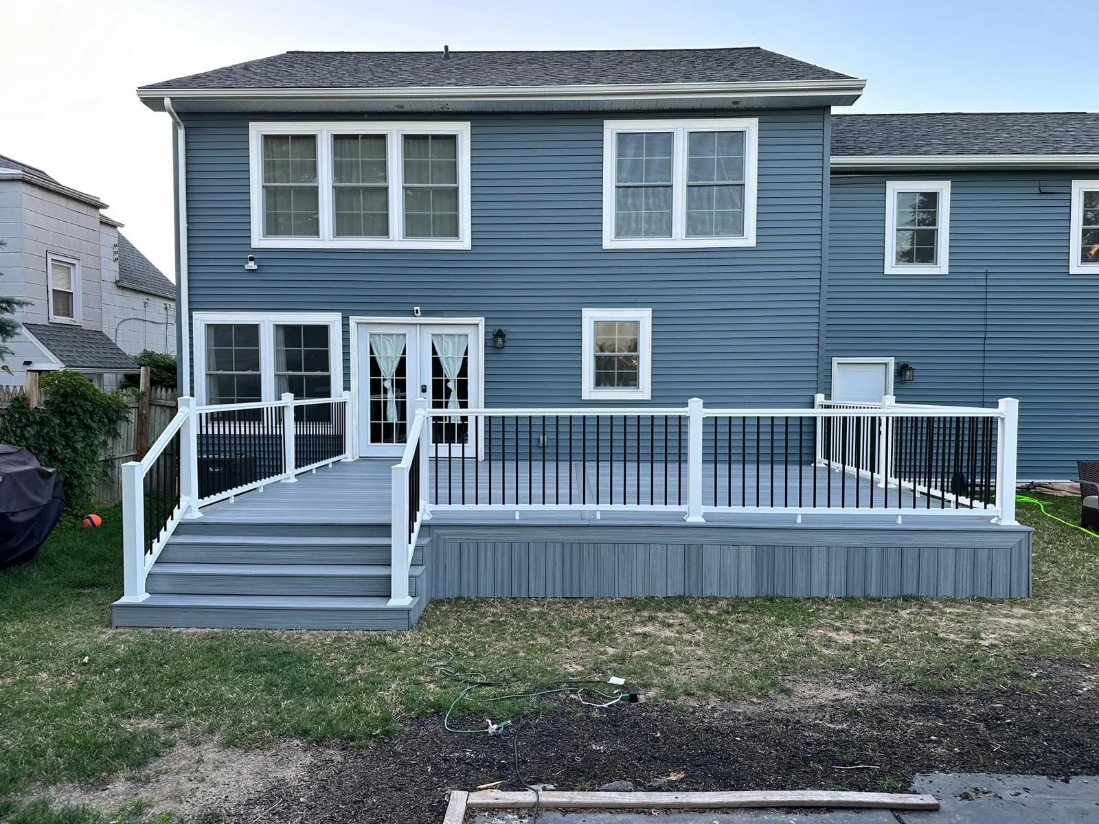 Multi-level composite deck backyard angle — Buffalo NY