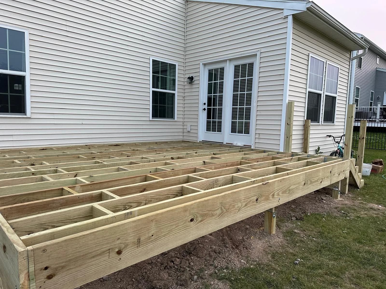 PT deck framing with post bases — Buffalo NY