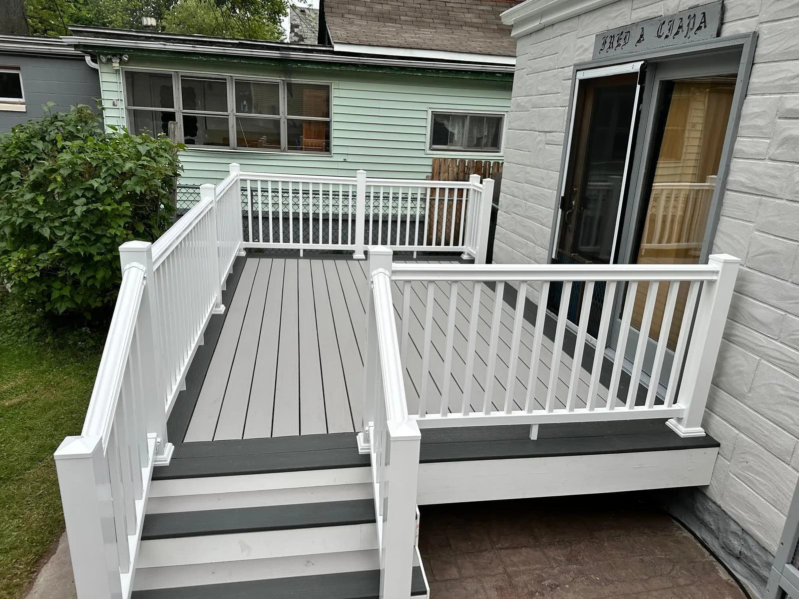 White composite deck backyard view — Buffalo NY