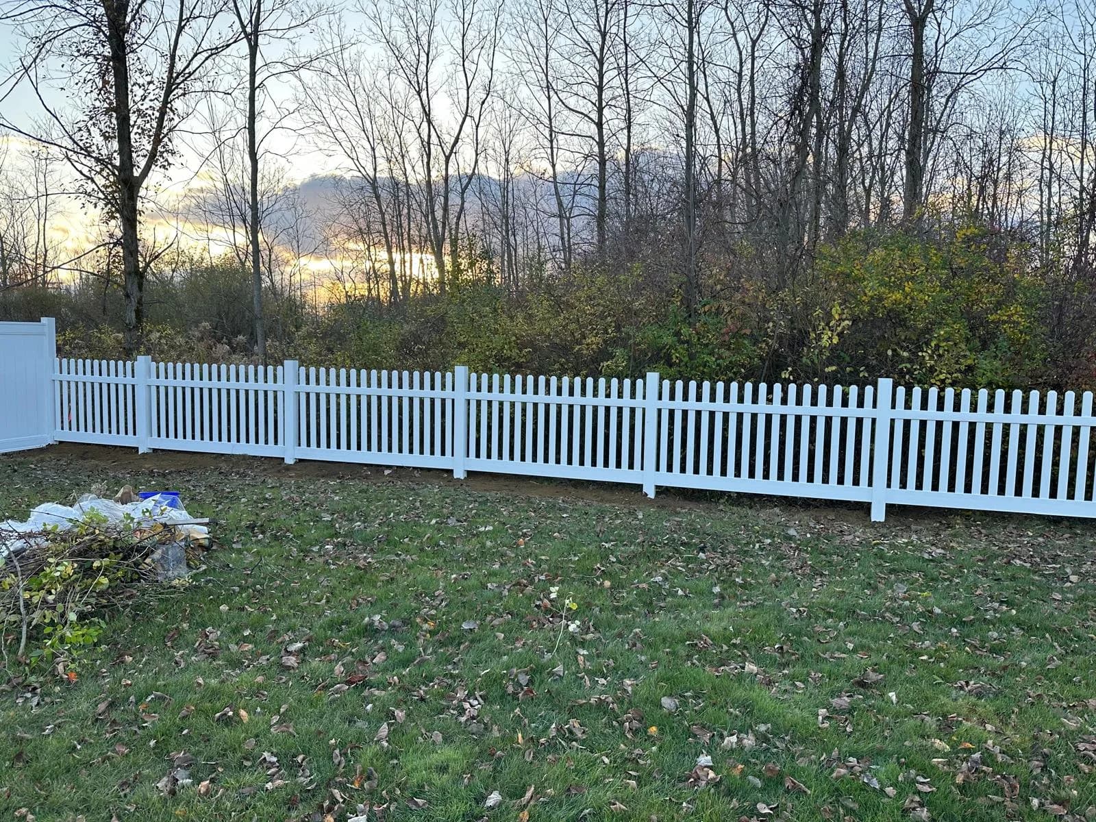 White vinyl privacy fence in backyard — Buffalo NY